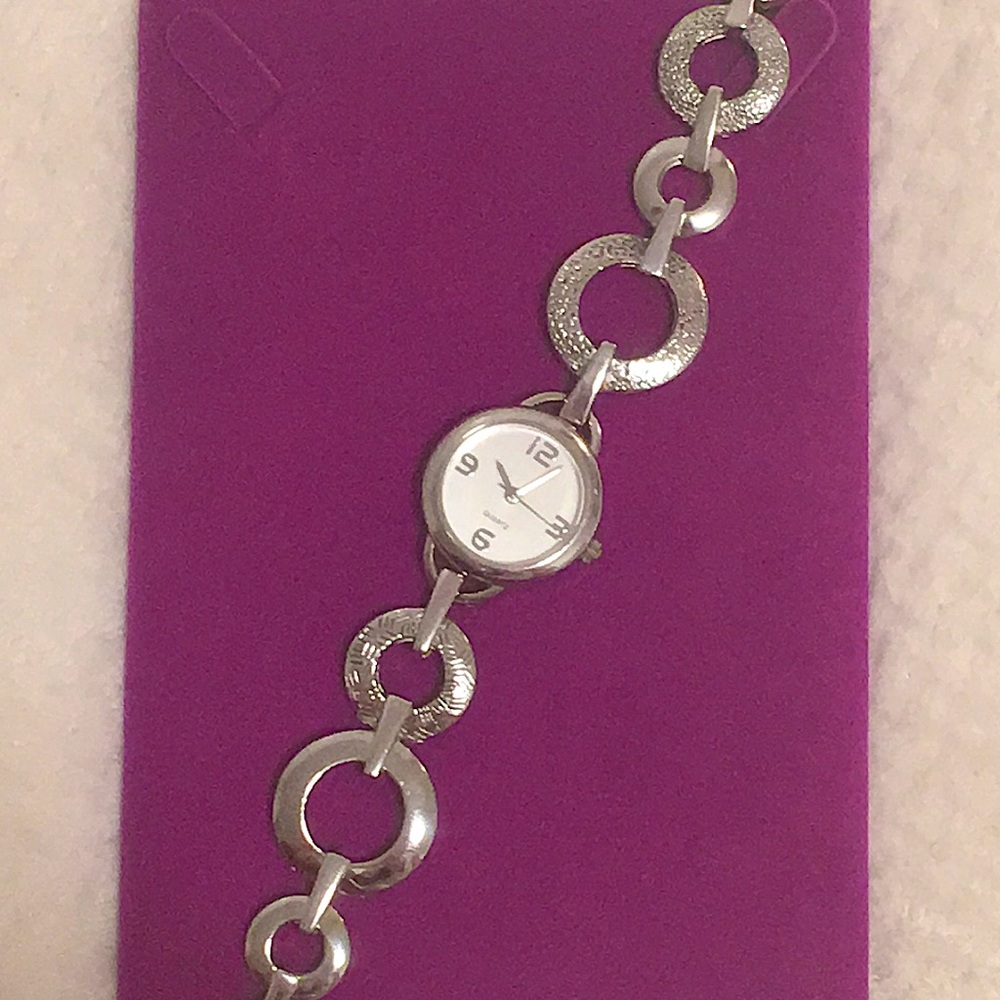 Silver toned watch. Walmart. 6 3/4 inches long. Used, like new.